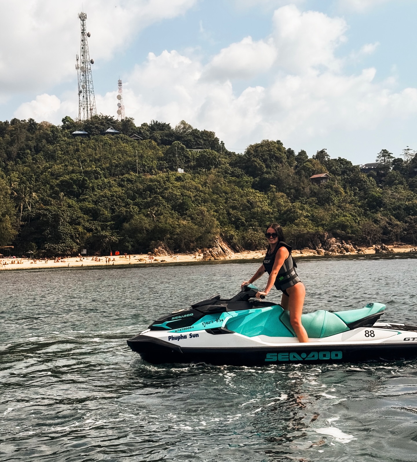 Rider on a Sea-Doo jet ski along the Koh Samui coastline at golden hour